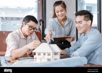 Businessman and architech meeting for planing and checking house design ...