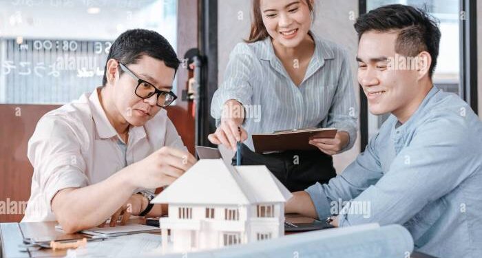 Businessman and architech meeting for planing and checking house design ...